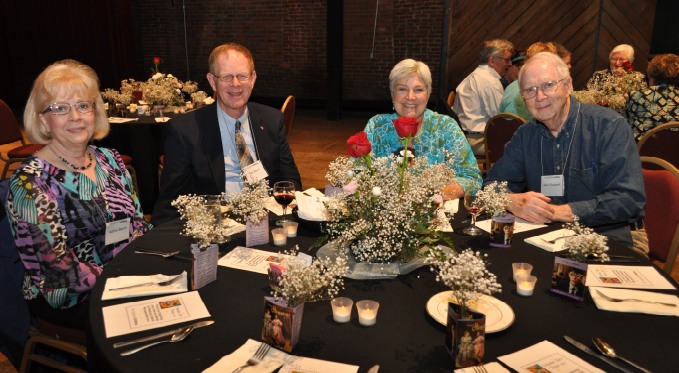 Scenes from one of our Volunteer Stars dinners. Volunteers enjoy a catered meal, entertainment, fellowship, and prizes. 