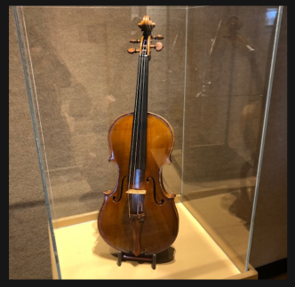 Violin from Violins of Hope in a display case
